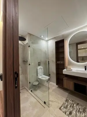 a bathroom with a toilet and a sink and a shower at Atlas-Si Cosy Appart Carré Eden in Marrakech