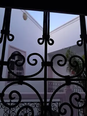 a view from a window of a balcony at Riad Paillettes in Marrakech