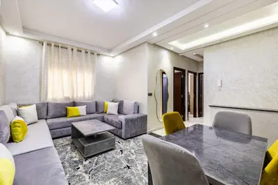 a living room with a couch and a table at Comfort and Simplicity in Marrakech in Marrakech