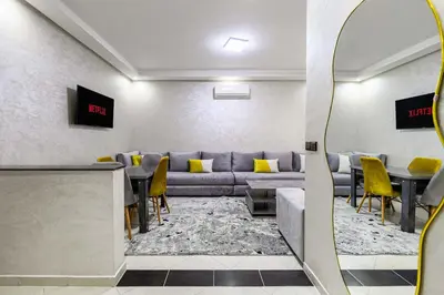 a waiting room with a couch and a table at Comfort and Simplicity in Marrakech in Marrakech