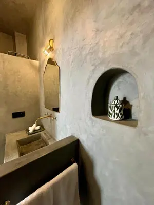 a bathroom with a sink and a mirror at Riad Muvira in Marrakech