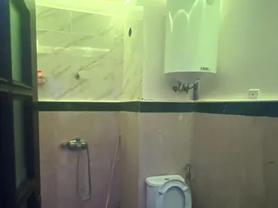 a small bathroom with a toilet and a sink at Sweet 1 Bed Room Appart in Marrakech