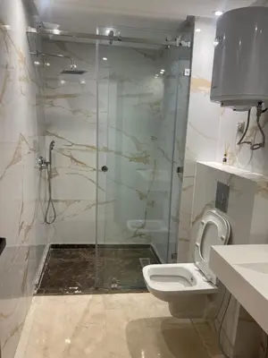 a bathroom with a shower and a toilet at Éros in Marrakech