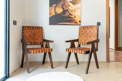 two chairs sitting next to each other in a room at splendid Villa King palace in Marrakech
