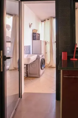 a bathroom with a sink and a washing machine at 