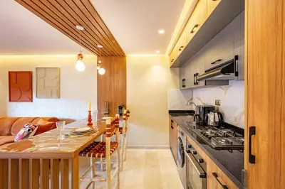 a kitchen with a counter and a stove top oven at Modern Jewel Central and Premium comfort in Marrakech