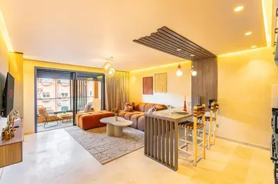 a living room with a couch and a table at Modern Jewel Central and Premium comfort in Marrakech