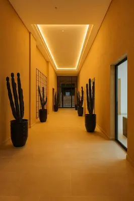a hallway with a row of cactus plants in pots at Jnane el Ali Gueliz in Marrakech