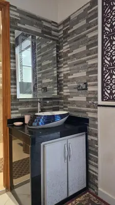 a bathroom with a sink and a mirror at Near Airport hosting in Marrakech