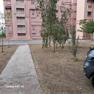 a sidewalk in front of a pink building at Appartement Marrakech in Marrakech