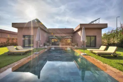 a house with a swimming pool in the yard at Villa Marrakech in Marrakech