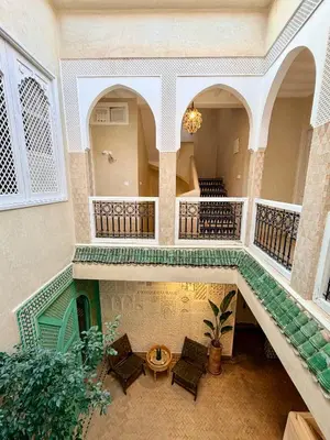 an overhead view of a building with a staircase at Riad El Badun in Marrakech