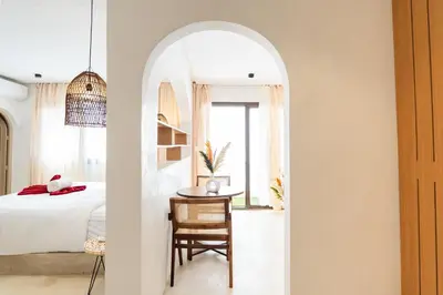 a bedroom with a bed and a table with a chair at Architect's studio in the city center! in Marrakech