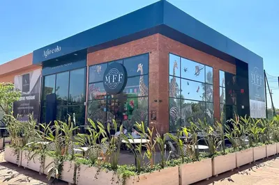 a restaurant with plants in front of a building at Cosy Apartment with Balcony and Pool in Noria Golf in Marrakech