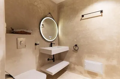 a bathroom with a sink and a mirror at Refined studio in the city center! in Marrakech