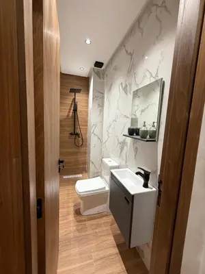 a bathroom with a white toilet and a sink at Villa Aliya in Marrakech