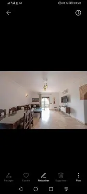 a view of a living room with a dining room and a kitchen at pation et jardin in Marrakech