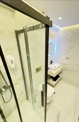 a bathroom with a shower and a toilet and a sink at Appartement Jamaa El Fna View in Marrakech