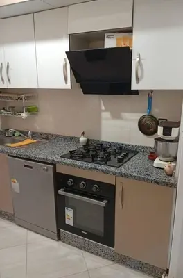 a kitchen with a stove and a counter top at Appartement Jamaa El Fna View in Marrakech