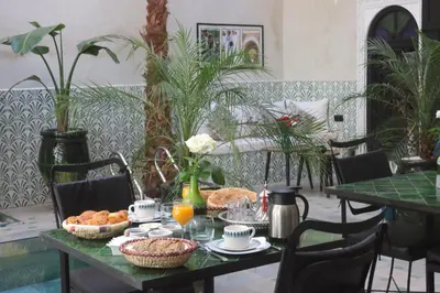 a table with food and drinks on top of it at riad NAMLA in Marrakech