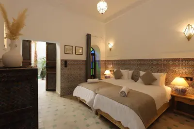 a bedroom with a large bed in a room at riad NAMLA in Marrakech
