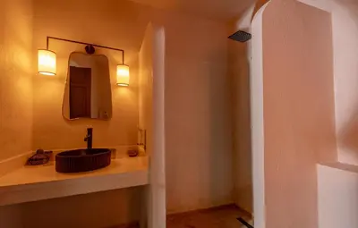 a bathroom with a sink and a mirror at Riad Cedrat in Marrakech