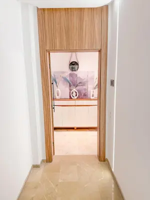 a hallway with a door leading into a room at Studio haut standing in Marrakech
