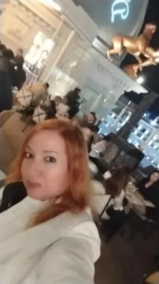 a woman with red hair sitting in a hair salon at Al andalous in Marrakech
