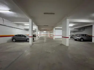 an empty parking garage with cars parked in it at Chic 2BDR Apartment in Gueliz in Marrakech