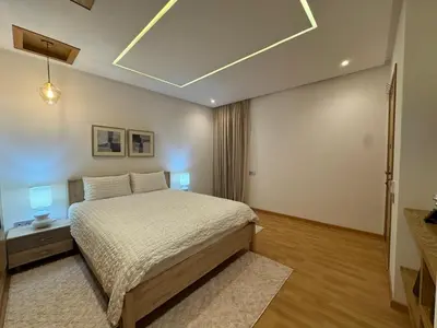 a bedroom with a bed in a room at Chic 2BDR Apartment in Gueliz in Marrakech