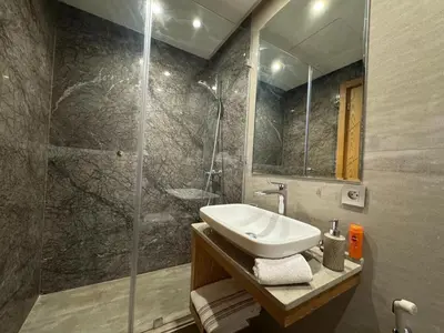 a bathroom with a sink and a shower at Chic 2BDR Apartment in Gueliz in Marrakech