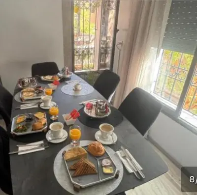a table with plates of food on top at Mohsine in Marrakech