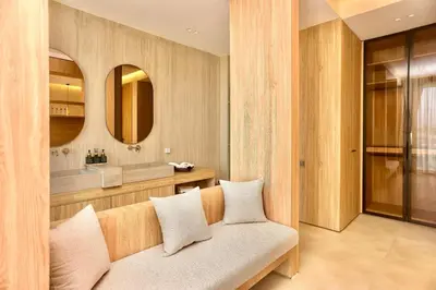 a living room with a couch and a mirror at Villa youngLA in Sehib Foukani