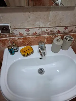 a white sink with various items on top of it at Appartememt Hivernage 4 in Marrakech