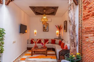 a living room with a couch and a table at Riad Musee in Marrakech