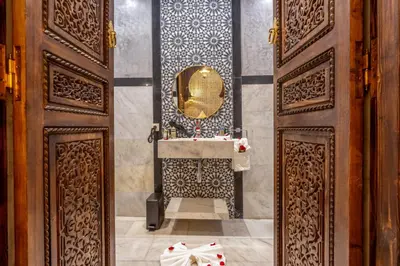 a bathroom with a sink and a mirror at Riad Musee in Marrakech