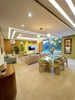 a large living room with a table and chairs at Villa Elixir , Luxury residence , private pool in El Rhechat