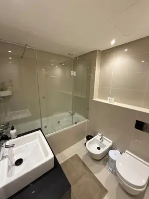 a bathroom with a sink and a toilet and a shower at Prestigia Pool 5 min Airport in Marrakech