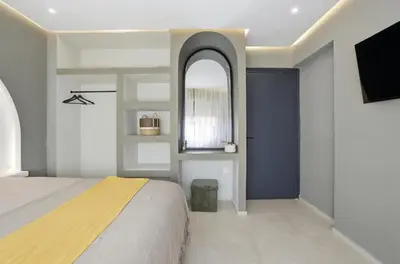 a bedroom with a bed and a mirror and a tv at Cosy Modern Apartment Central Gueliz Marrakech in Marrakech