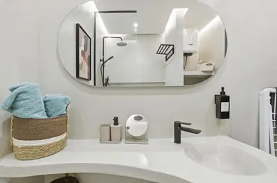 a bathroom with a sink and a mirror at Cosy Modern Apartment Central Gueliz Marrakech in Marrakech