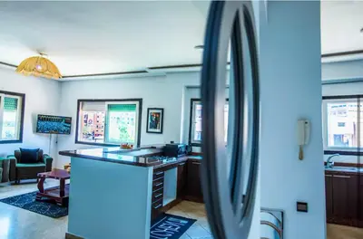 a bathroom with a counter and a mirror at Appartement moderne Guéliz, Centre Marrakech in Marrakech