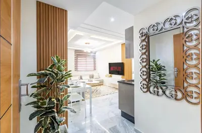 a living room with a mirror and a couch at Cosy studio au cœur de Marrakech in Marrakech