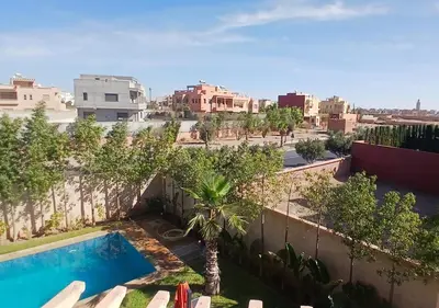 a view from the roof of a building with a swimming pool at Villa Élégance Familiale in Marrakech
