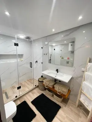 a bathroom with a sink and a shower at Green in majorelle in Marrakech