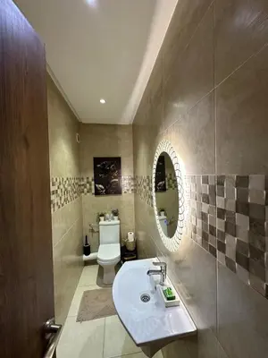 a bathroom with a sink and a toilet at Amazing well located appartement centre of marrakech near medina in Marrakech