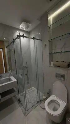 a bathroom with a shower and a toilet and a sink at Riad Medina Palmeraie in Marrakech