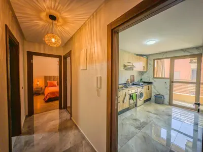 a kitchen with a door leading to a bedroom at Modern & cozy 2 bedroom apartment in Marrakech