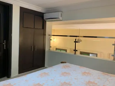a bedroom with a large mirror and a bed at Appartements du luxe in Marrakech