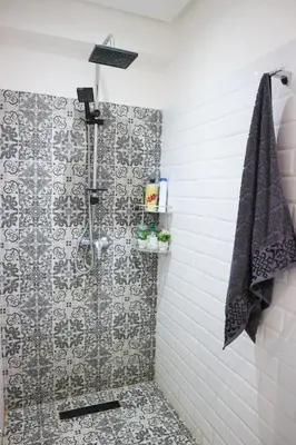 a bathroom with a shower with a tiled wall at Central B1 Chic & Shock , hivernage city center in Marrakech