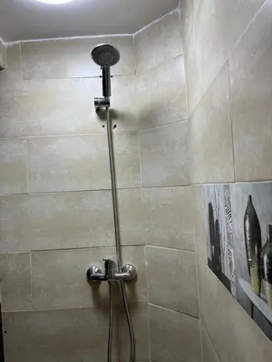 a shower with a shower head in a bathroom at MarrakLuft in Marrakech